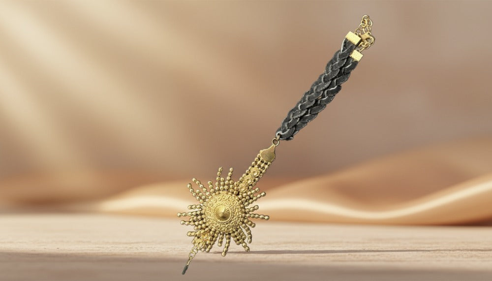 Gold Sunburst Pendant with Braided Black Cord