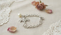 Silver Bracelet with Pearl and Cross Charm