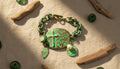Green Cross Bracelet with Charms and Pearl Accents