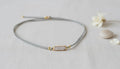 Cord Necklace with a Gold and Crystal Charm