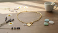 Gold-Tone Necklace with Religious-Themed Charms